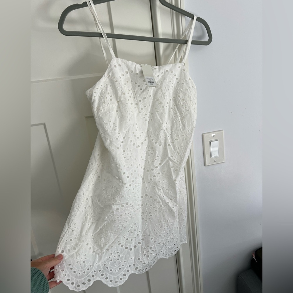 White eyelet mini dress. Great for graduation or summer party! Jun & Ivy